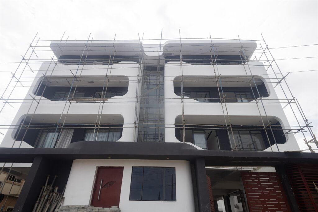 Brum Height 9: Street-level view of the facade with scaffolding in place